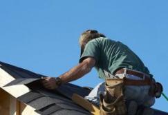 roofing contractor replaces tile