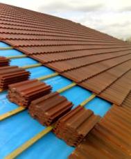Clay roof tiling in progress